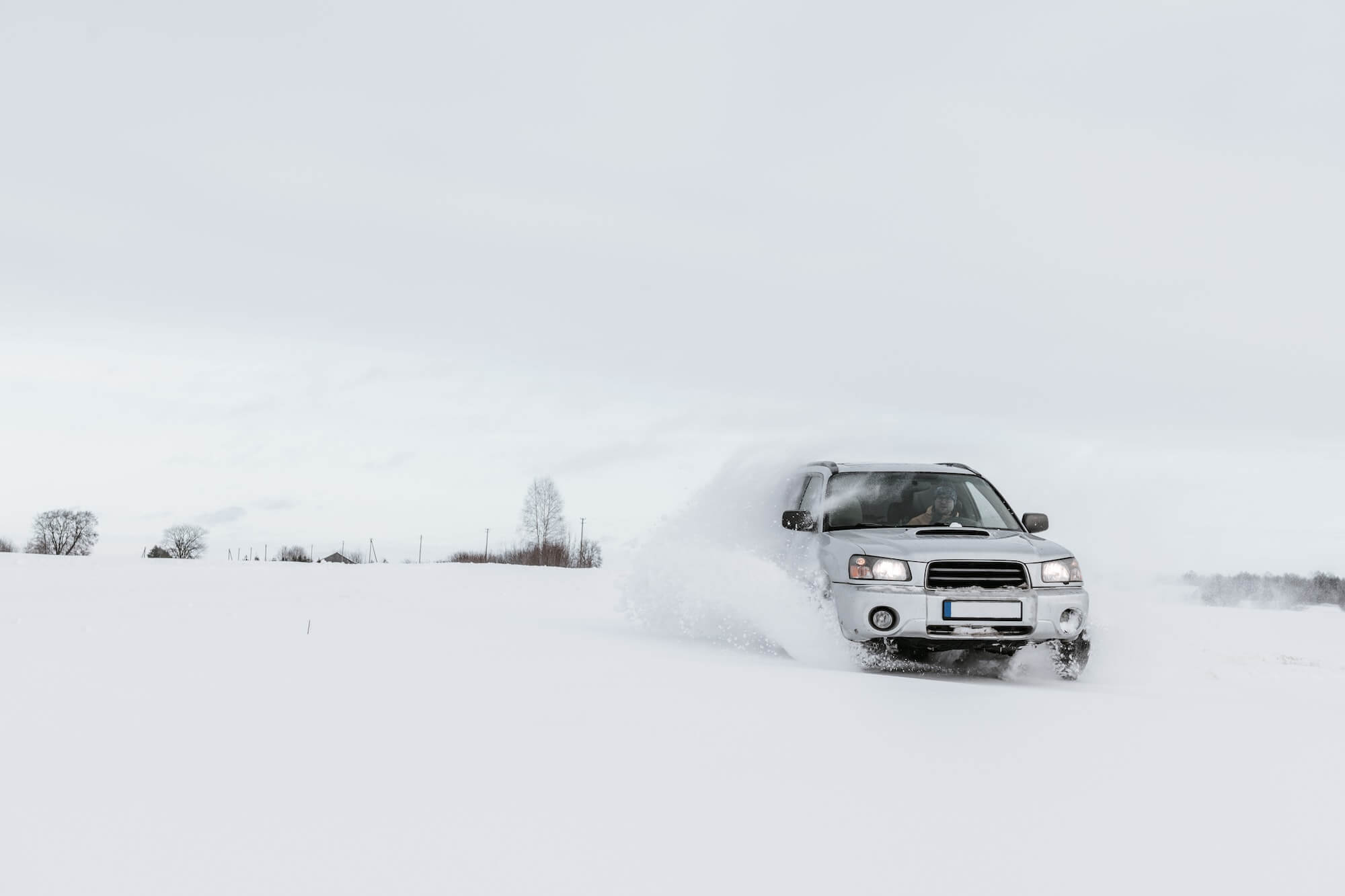 car-driving-on-snow-field-1.jpg